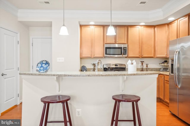 444 Exchange Ave Unit 444, Gaithersburg, MD 20878 - kitchen featuring appliances with stainless steel finishes, light wood finished floors, crown molding, a kitchen breakfast bar, and light brown cabinetry