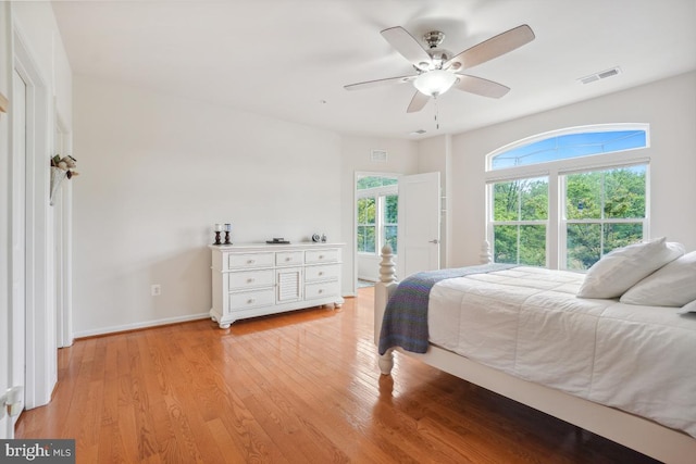 444 Exchange Ave Unit 444, Gaithersburg, MD 20878 - bedroom with light wood-style floors, baseboards, and ceiling fan