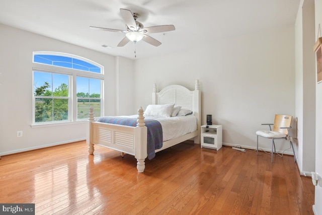 444 Exchange Ave Unit 444, Gaithersburg, MD 20878 - bedroom with light wood-style flooring, baseboards, and ceiling fan