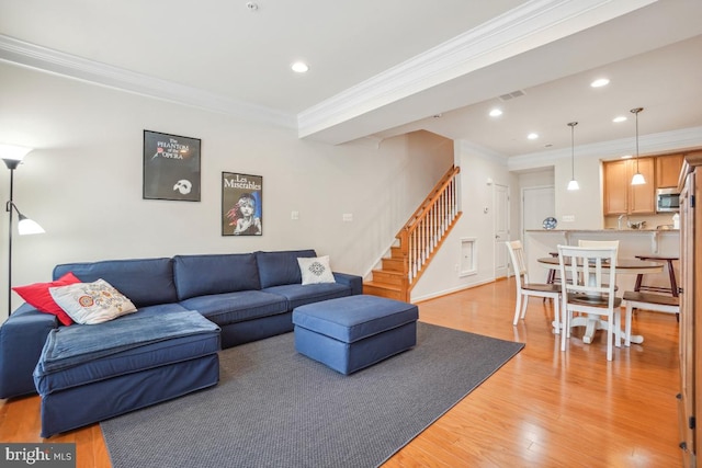 444 Exchange Ave Unit 444, Gaithersburg, MD 20878 - living room with stairs, crown molding, light wood-type flooring, recessed lighting, and baseboards