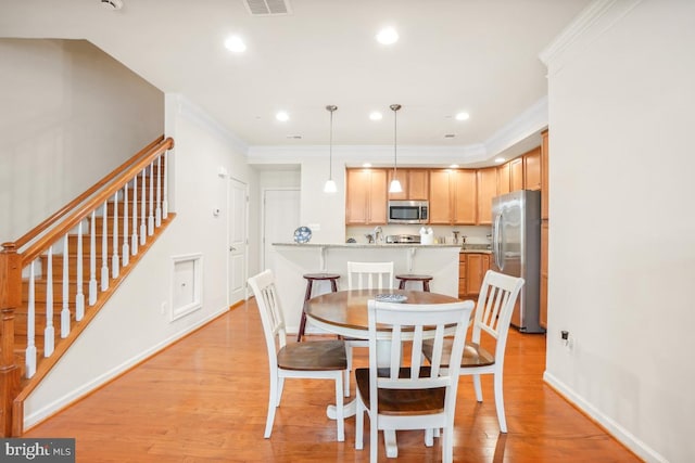 444 Exchange Ave Unit 444, Gaithersburg, MD 20878 - dining area featuring ornamental molding, stairway, light wood finished floors, baseboards, and recessed lighting