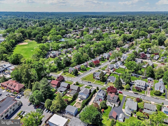 aerial view of property and surrounding area with nearby suburban area