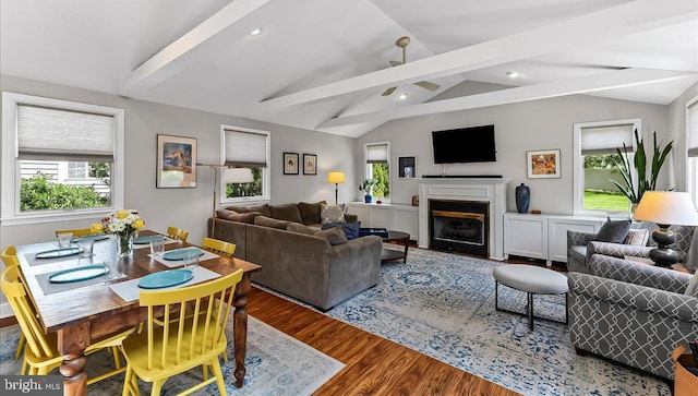 living room featuring plenty of natural light, wood finished floors, a fireplace, ceiling fan, and recessed lighting