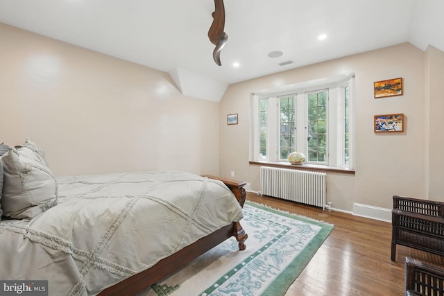 4301 Forest Ln NW, Washington, DC 20007 - bedroom with radiator heating unit, lofted ceiling, baseboards, wood finished floors, and recessed lighting