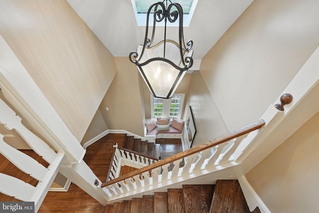 4301 Forest Ln NW, Washington, DC 20007 - staircase with a chandelier, high vaulted ceiling, and wood finished floors
