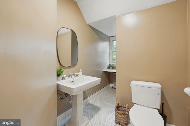 4301 Forest Ln NW, Washington, DC 20007 - bathroom with toilet, vaulted ceiling, and tile patterned floors