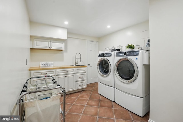 4301 Forest Ln NW, Washington, DC 20007 - laundry room with separate washer and dryer, recessed lighting, dark tile patterned floors, and cabinet space