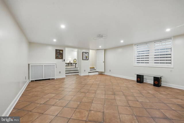 4301 Forest Ln NW, Washington, DC 20007 - finished below grade area with stairway, recessed lighting, radiator, tile patterned floors, and baseboards