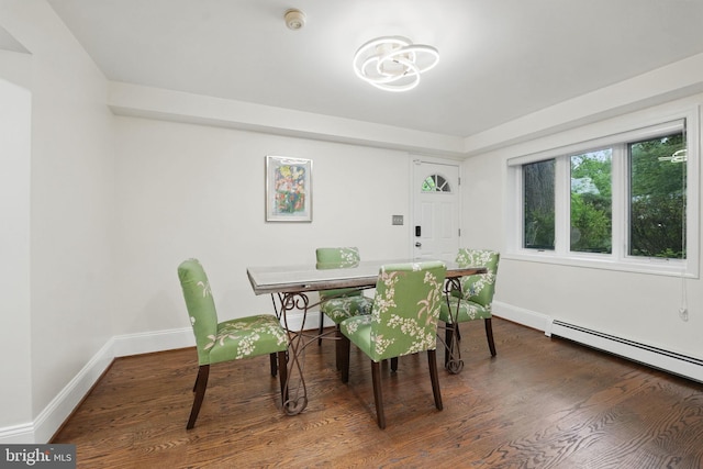 4301 Forest Ln NW, Washington, DC 20007 - dining area with a baseboard radiator, wood finished floors, baseboards, and a chandelier