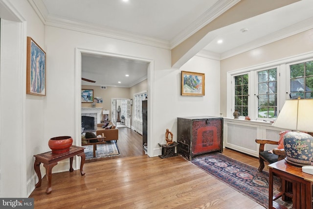 4301 Forest Ln NW, Washington, DC 20007 - living area with wood finished floors, a fireplace, ornamental molding, baseboards, and recessed lighting