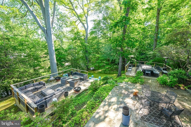 4301 Forest Ln NW, Washington, DC 20007 - view of yard with a wooden deck, a patio, and an outdoor living space with a fire pit