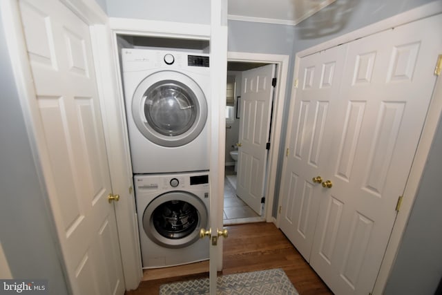 10 Casimir Ct, New Castle, DE 19720 - washroom with stacked washer / dryer, dark wood-style flooring, and crown molding