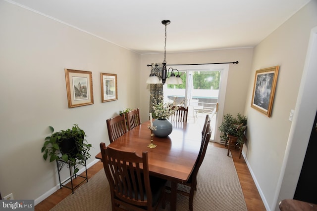 10 Casimir Ct, New Castle, DE 19720 - dining space with wood finished floors, baseboards, a chandelier, and ornamental molding