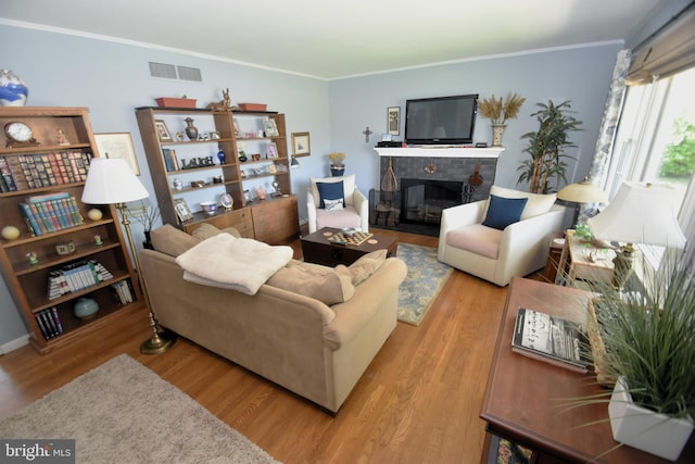 10 Casimir Ct, New Castle, DE 19720 - living area featuring wood finished floors, ornamental molding, and a glass covered fireplace