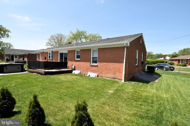 10 Casimir Ct, New Castle, DE 19720 - back of property featuring brick siding, a wooden deck, and central air condition unit