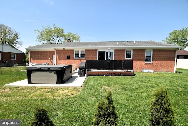10 Casimir Ct, New Castle, DE 19720 - back of house featuring a hot tub, brick siding, and a chimney