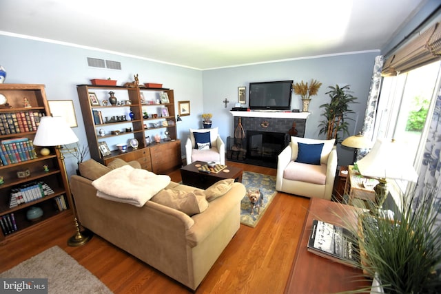 10 Casimir Ct, New Castle, DE 19720 - living area featuring wood finished floors, ornamental molding, and a glass covered fireplace