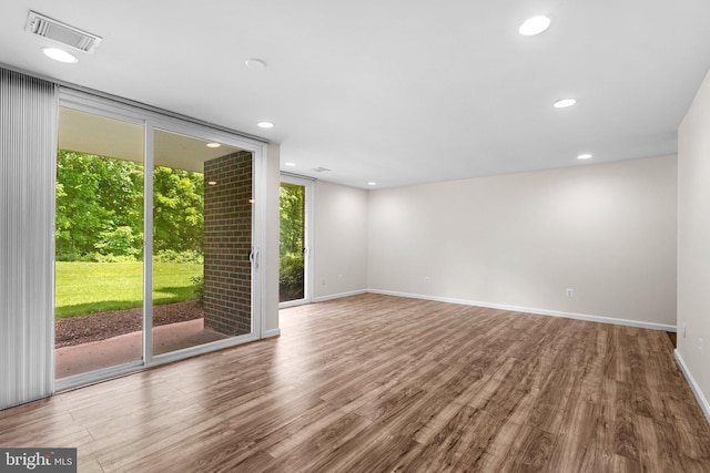 10234 Prince Pl Unit 17-T2, Upper Marlboro, MD 20774 - unfurnished room with wood finished floors, recessed lighting, baseboards, and floor to ceiling windows