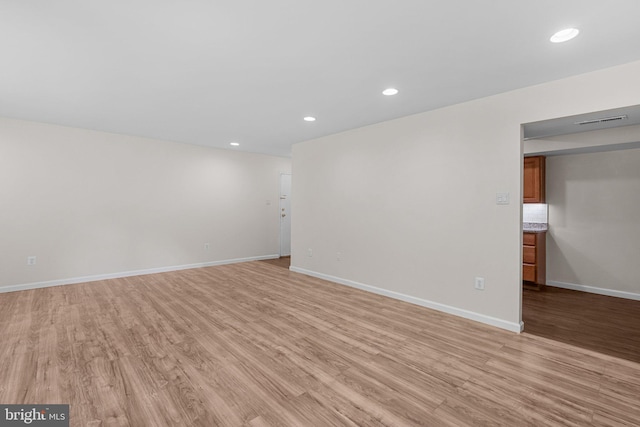 10234 Prince Pl Unit 17-T2, Upper Marlboro, MD 20774 - spare room with light wood-style floors, baseboards, and recessed lighting