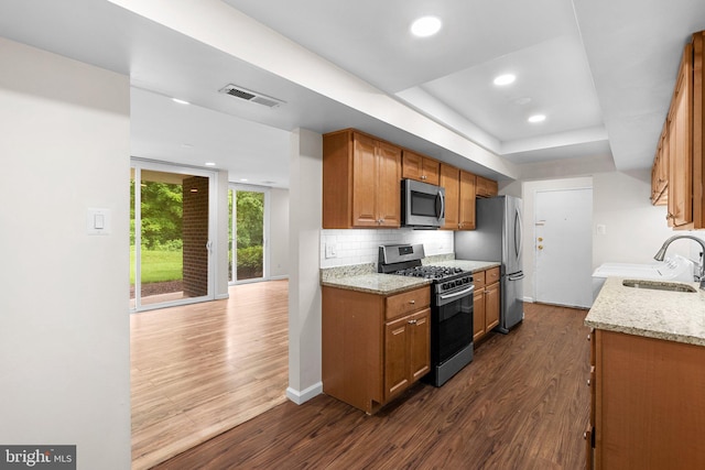 10234 Prince Pl Unit 17-T2, Upper Marlboro, MD 20774 - kitchen with stainless steel appliances, a sink, dark wood-style floors, tasteful backsplash, and recessed lighting