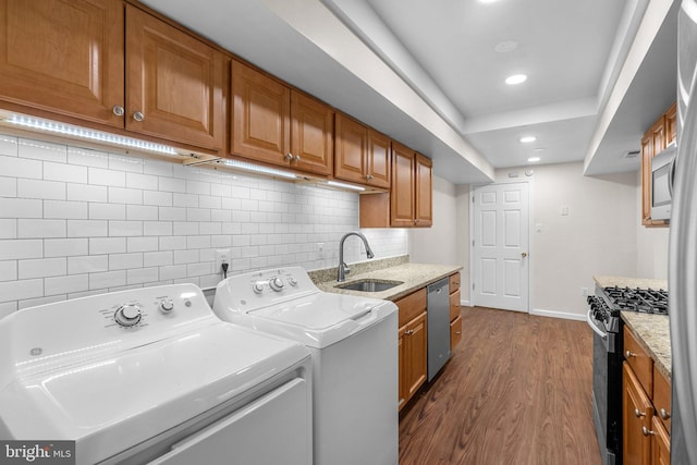 10234 Prince Pl Unit 17-T2, Upper Marlboro, MD 20774 - laundry area featuring dark wood-style flooring, separate washer and dryer, baseboards, and recessed lighting