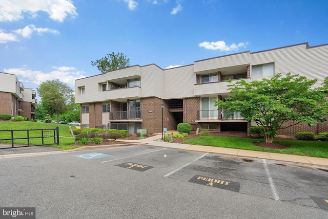 10234 Prince Pl Unit 17-T2, Upper Marlboro, MD 20774 - view of building exterior with uncovered parking