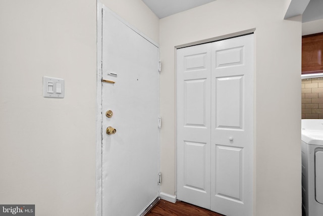10234 Prince Pl Unit 17-T2, Upper Marlboro, MD 20774 - laundry area featuring washer / dryer, dark wood-style flooring, and baseboards
