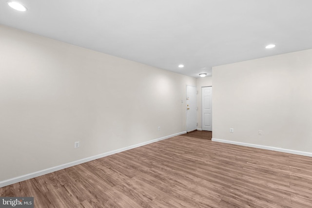 10234 Prince Pl Unit 17-T2, Upper Marlboro, MD 20774 - empty room featuring light wood finished floors, recessed lighting, and baseboards