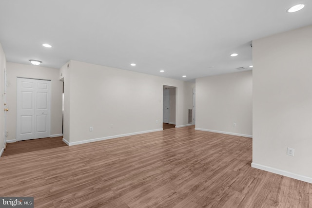 10234 Prince Pl Unit 17-T2, Upper Marlboro, MD 20774 - spare room featuring light wood finished floors, recessed lighting, and baseboards