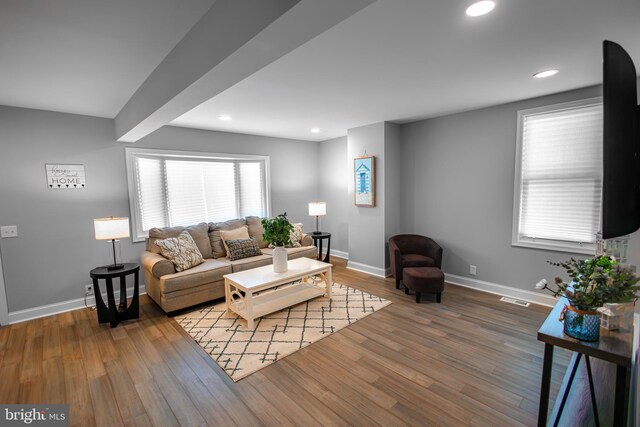 8035 Wood Ave, Sparrows Point, MD 21219 - living room featuring baseboards, wood finished floors, and recessed lighting