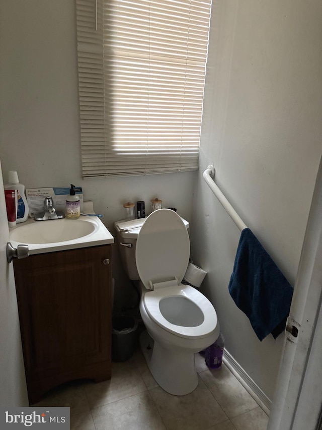 3857 N Marshall St, Philadelphia, PA 19140 - half bathroom featuring tile patterned floors, vanity, and toilet