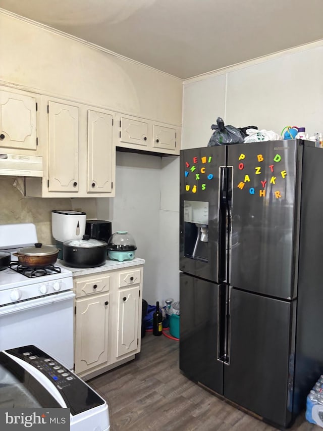 3857 N Marshall St, Philadelphia, PA 19140 - kitchen featuring refrigerator with ice dispenser, white gas range, under cabinet range hood, dark wood finished floors, and light countertops
