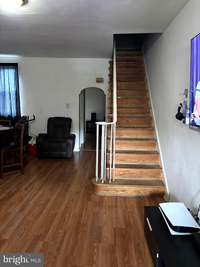 3857 N Marshall St, Philadelphia, PA 19140 - stairway featuring arched walkways and wood finished floors