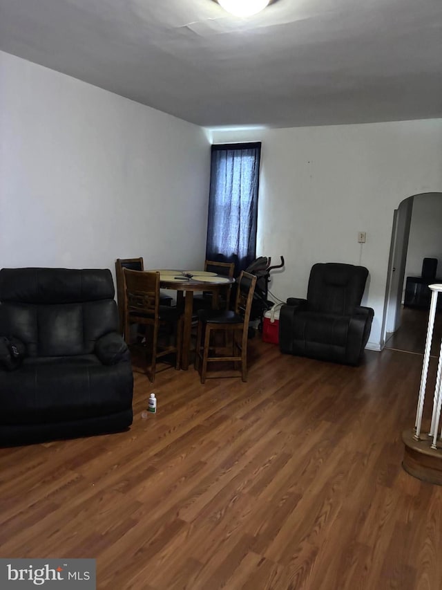 3857 N Marshall St, Philadelphia, PA 19140 - living area with wood finished floors and arched walkways