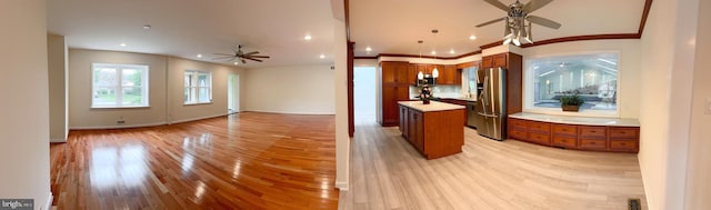 1392 Kutz Dr, Pottstown, PA 19465 - kitchen with ceiling fan, appliances with stainless steel finishes, brown cabinetry, light wood finished floors, and recessed lighting