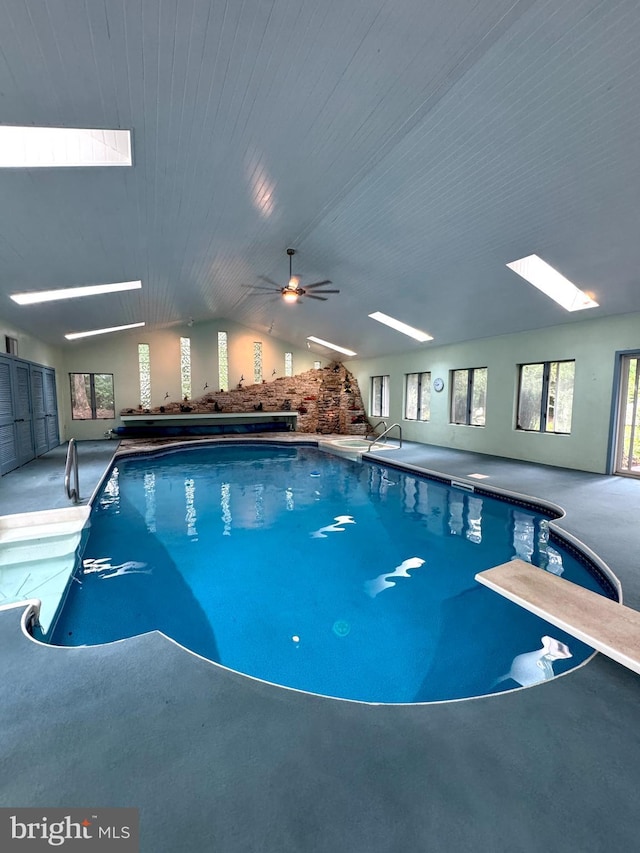 1392 Kutz Dr, Pottstown, PA 19465 - indoor pool featuring a diving board, ceiling fan, and a skylight