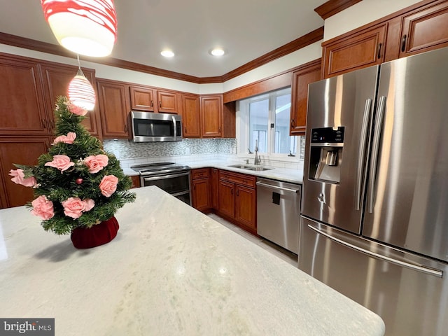 1392 Kutz Dr, Pottstown, PA 19465 - kitchen with appliances with stainless steel finishes, brown cabinetry, tasteful backsplash, crown molding, and hanging light fixtures