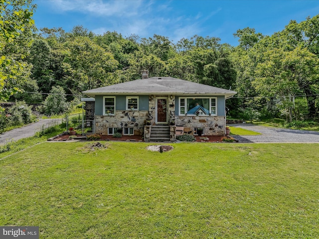 9 S Laurel Ave, Berkeley Springs, WV 25411 - bungalow featuring stone siding, a front lawn, a view of trees, and a chimney