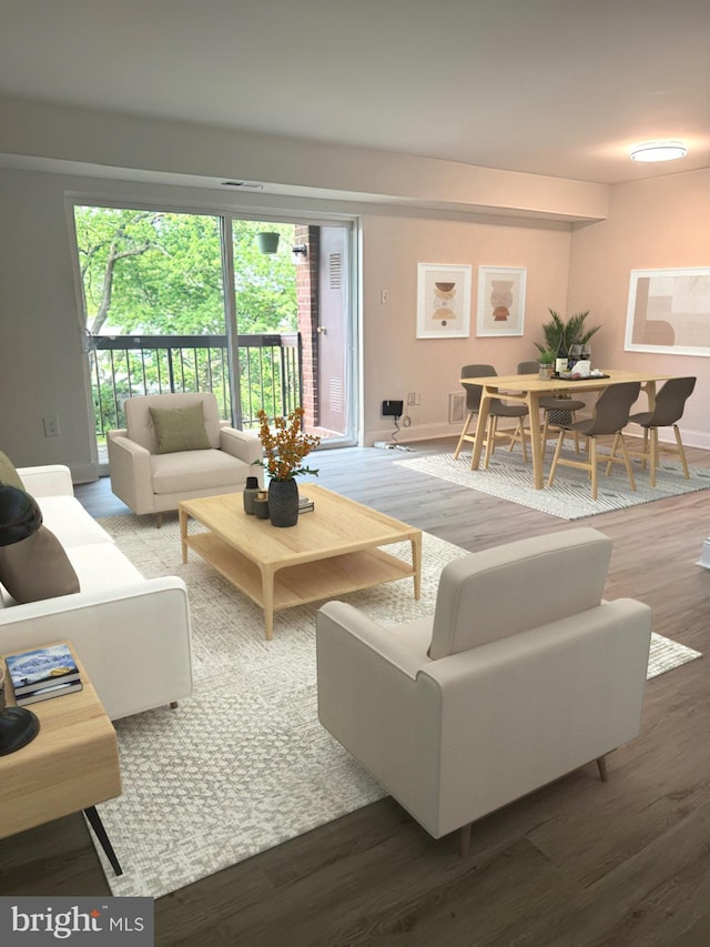 106 Mountain Rd Unit 2C, Glen Burnie, MD 21060 - living area featuring wood finished floors and baseboards