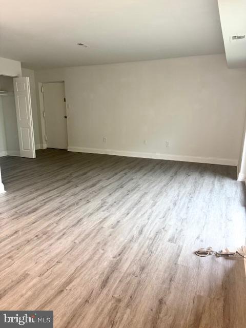106 Mountain Rd Unit 2C, Glen Burnie, MD 21060 - empty room with wood finished floors and baseboards