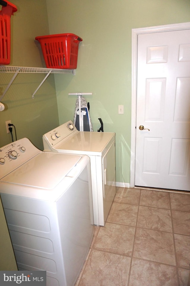 97 Burholme Dr, Hamilton, NJ 08691 - laundry room with independent washer and dryer, light tile patterned floors, and baseboards