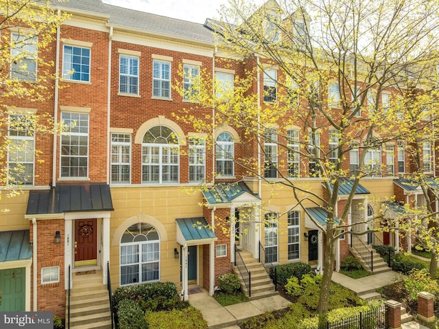1885 Crescent Park Dr, Reston, VA 20190 - view of property featuring brick siding and a standing seam roof