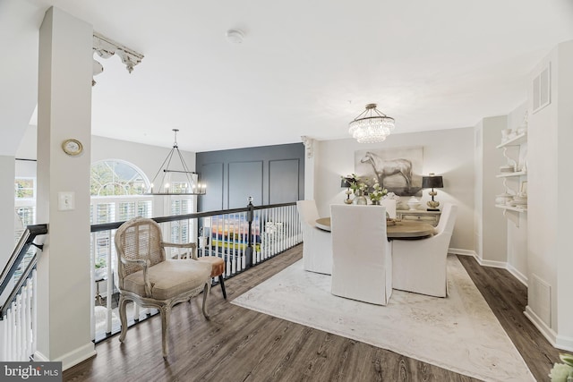 1885 Crescent Park Dr, Reston, VA 20190 - dining room featuring a chandelier, dark wood-style flooring, and baseboards
