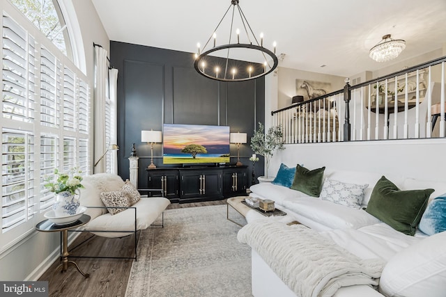 1885 Crescent Park Dr, Reston, VA 20190 - living area with a chandelier, wood finished floors, and stairway