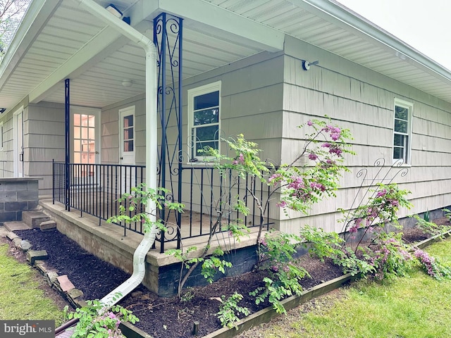view of side of property with a porch