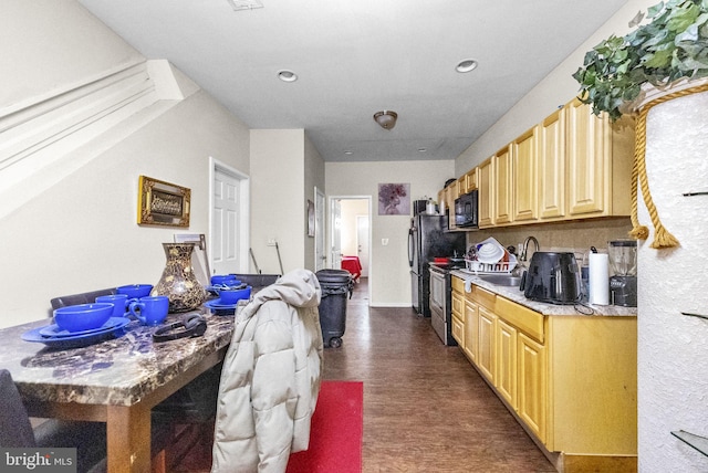 2562 N 31st St, Philadelphia, PA 19132 - kitchen with black appliances, light countertops, recessed lighting, a sink, and dark floors