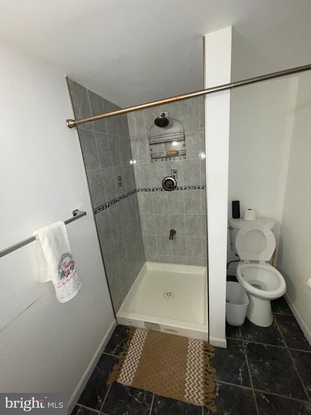 3110 Wellington St, Philadelphia, PA 19149 - bathroom with baseboards, a stall shower, and toilet