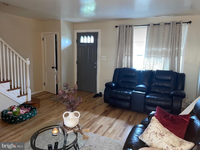 3110 Wellington St, Philadelphia, PA 19149 - living room featuring wood finished floors, stairs, and baseboards