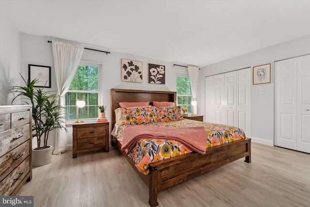 1702 Stoneham Dr, West Chester, PA 19382 - bedroom featuring light wood finished floors, multiple windows, and baseboards