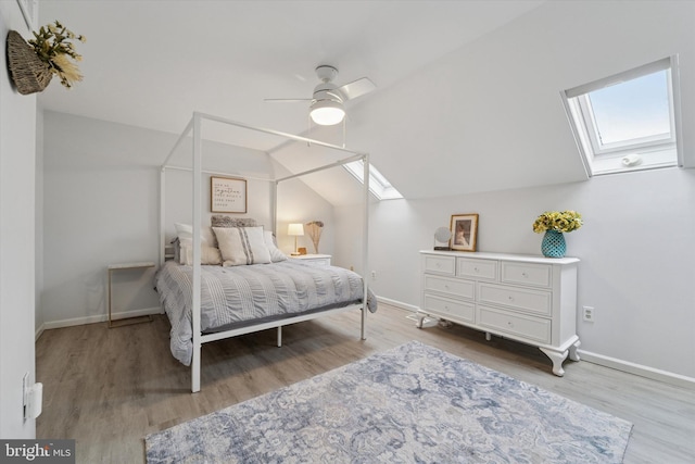 1702 Stoneham Dr, West Chester, PA 19382 - bedroom featuring a skylight, wood finished floors, baseboards, vaulted ceiling, and ceiling fan
